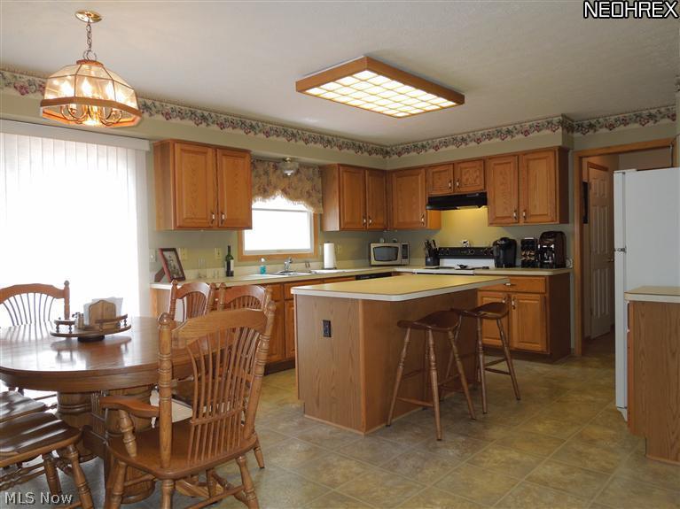 3828 Boston Road Brunswick, OH 44212 - Photo 2 of 16 Spacious and open Kitchen with a Breakfast Bar Island, Casual Dining Area & Raised Panel Cabinets!