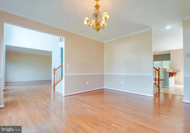 a view of livingroom with hardwood floor and hallway