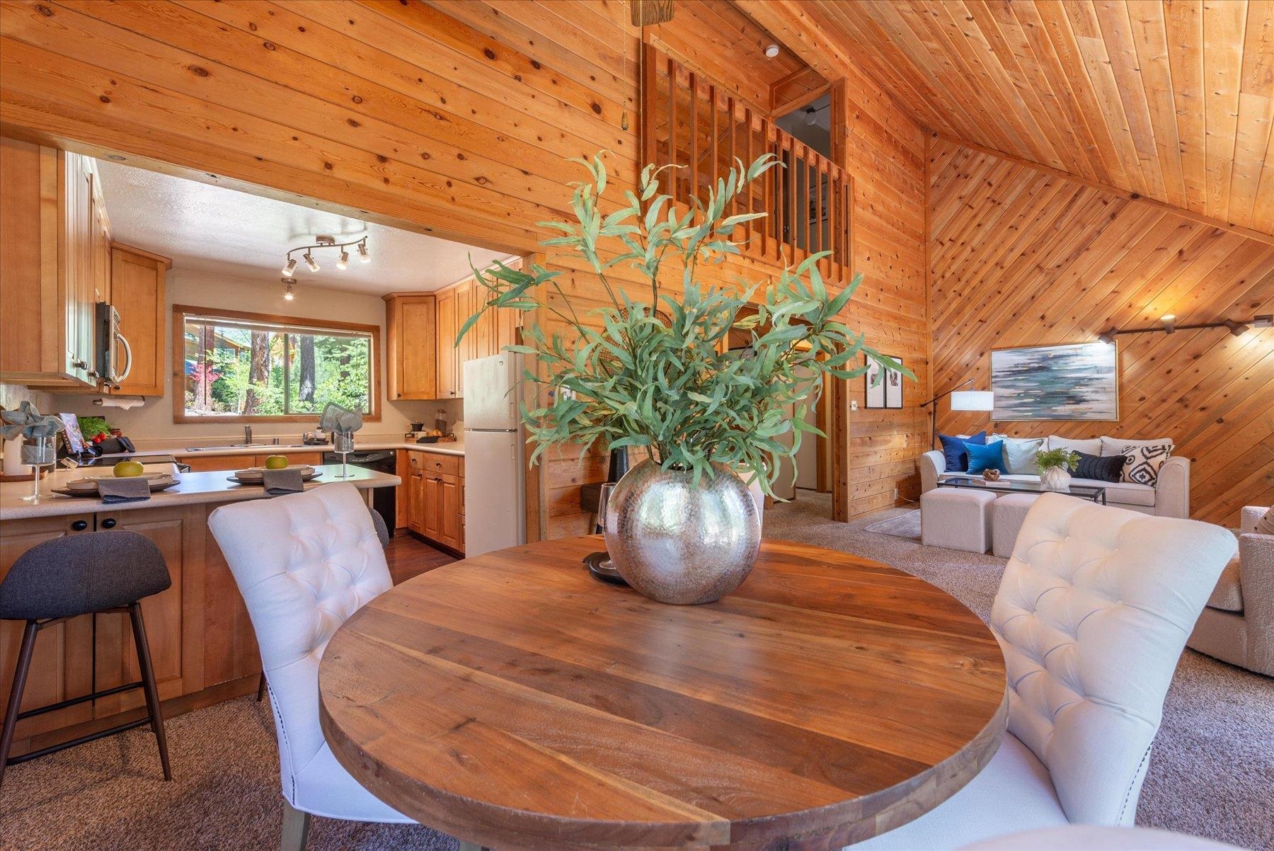 325 North Ridge Road Carnelian Bay, CA 96140 - Photo 13 of 22 a view of a dining room with furniture a potted plant and wooden floor