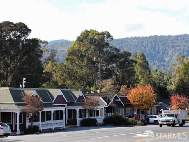 387 Moore Road Atherton, CA 94027 - Photo 22 of 25 a front view of a building with lot of cars and trees