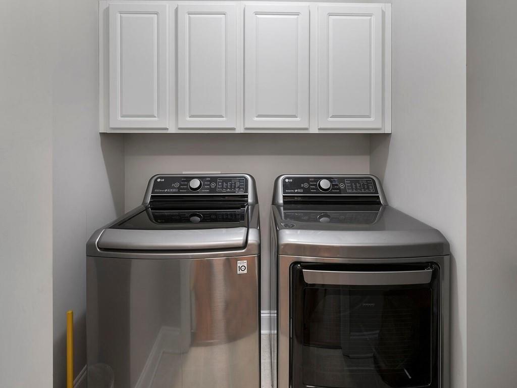 820 Freedom Lane Roswell, GA 30075 - Photo 16 of 30 a kitchen with granite countertop white cabinets and a stove top oven