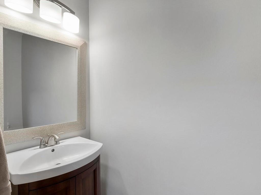 820 Freedom Lane Roswell, GA 30075 - Photo 17 of 30 a bathroom with a sink and a mirror
