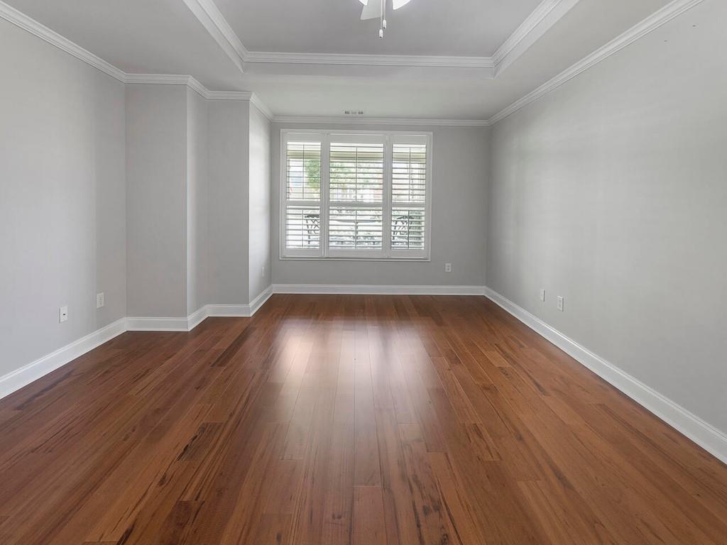 820 Freedom Lane Roswell, GA 30075 - Photo 18 of 30 a view of an empty room with wooden floor and a window