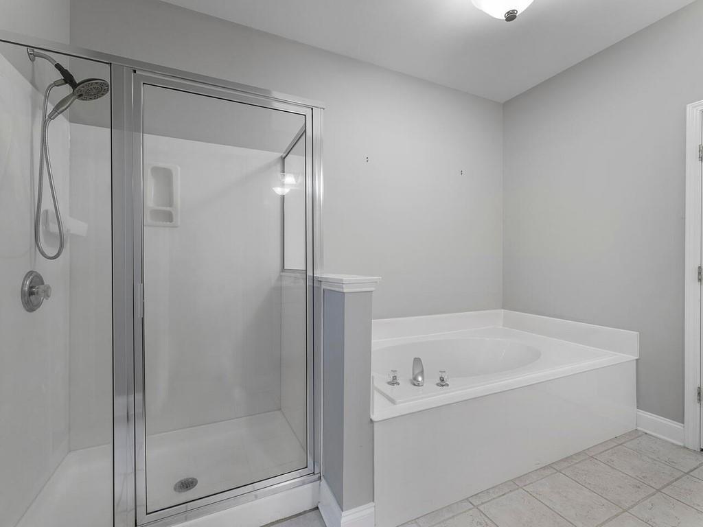 820 Freedom Lane Roswell, GA 30075 - Photo 21 of 30 a white bath tub sitting next to a shower