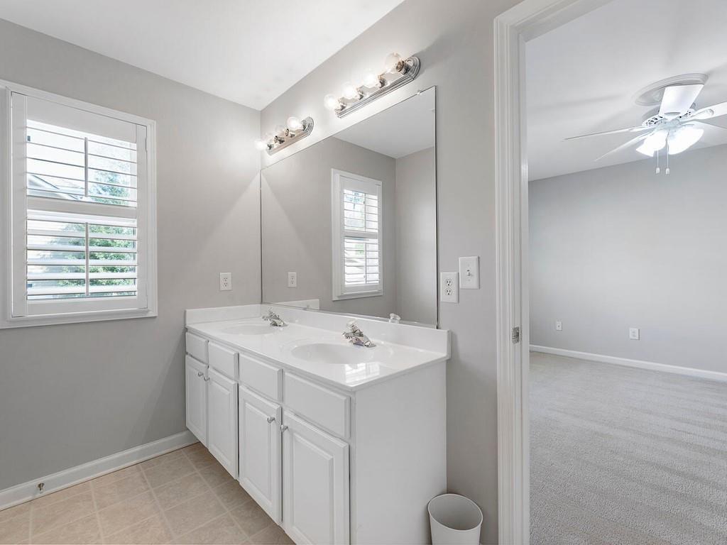 820 Freedom Lane Roswell, GA 30075 - Photo 26 of 30 a bathroom with a sink and a mirror