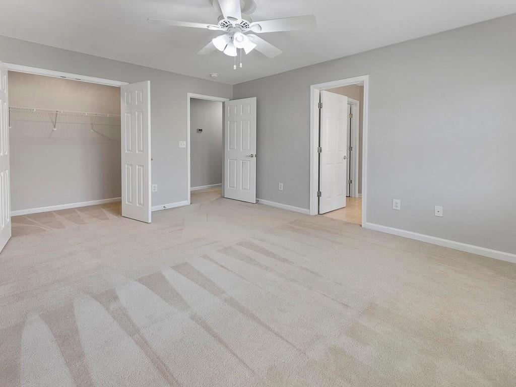 820 Freedom Lane Roswell, GA 30075 - Photo 29 of 30 a view of an empty room with a chandelier fan