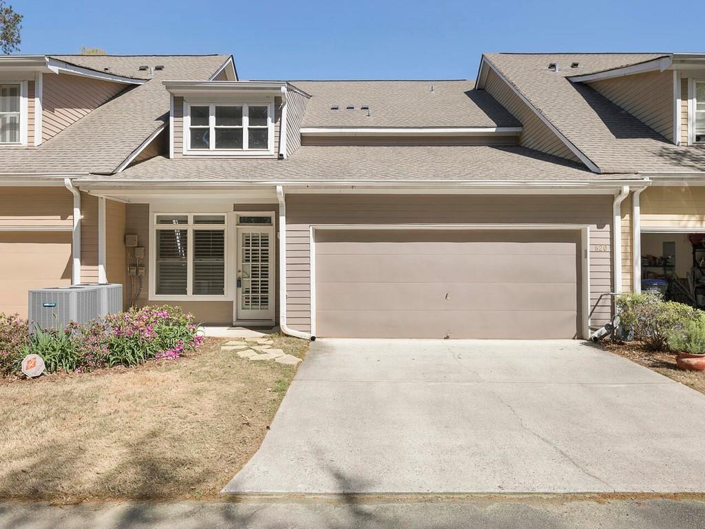 820 Freedom Lane Roswell, GA 30075 - Photo 30 of 30 a front view of a house with a yard and garage