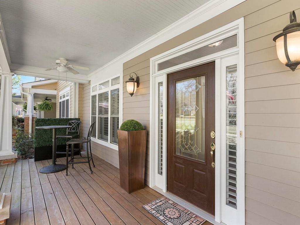 820 Freedom Lane Roswell, GA 30075 - Photo 3 of 30 a balcony with furniture and wooden floor