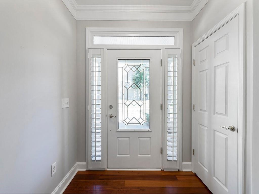 820 Freedom Lane Roswell, GA 30075 - Photo 5 of 30 a view of an empty room with wooden floor and a window