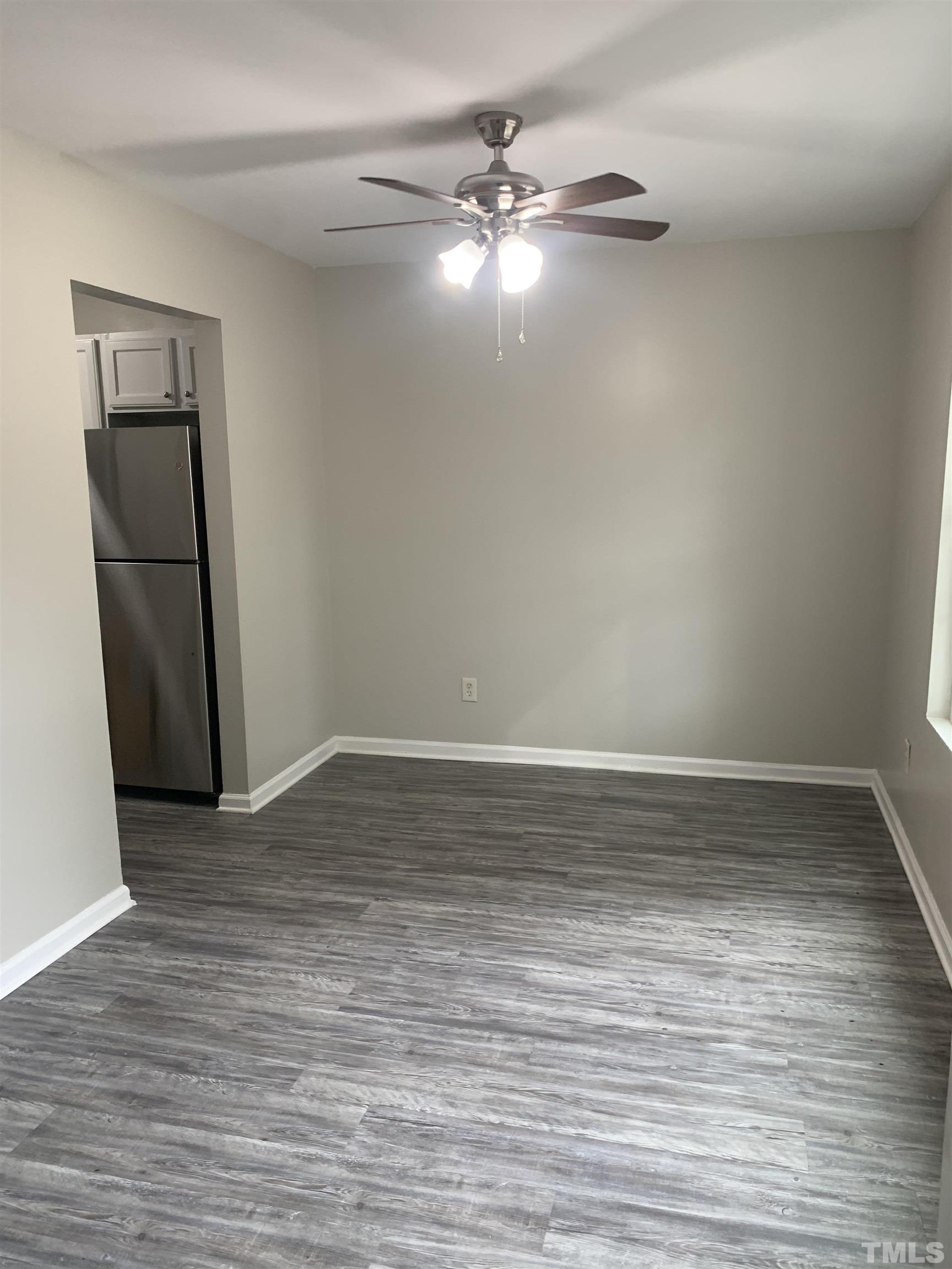 1315 East Lane Street, Unit 102 Raleigh, NC 27610 - Photo 6 of 6 a view of a room with wooden floor
