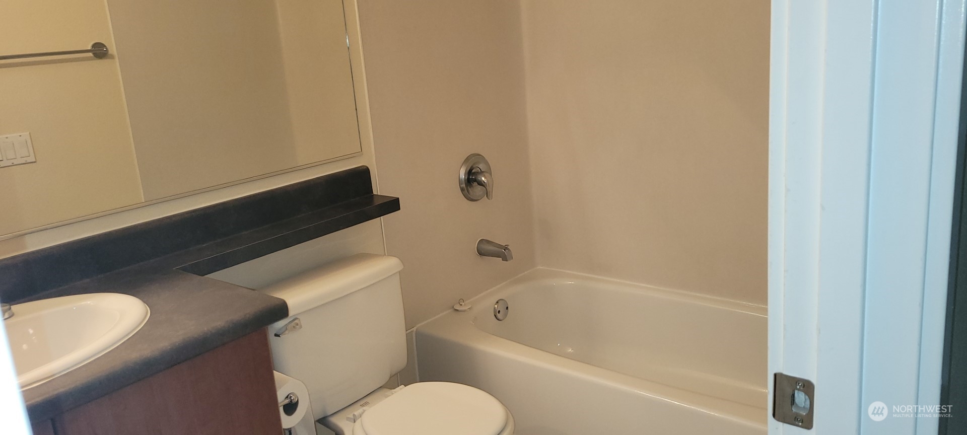 12404 East Gibson Road, Unit D201 Everett, WA 98204 - Photo 13 of 22 a bathroom with a toilet and a bathtub