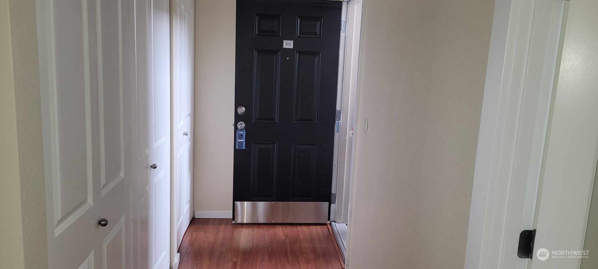 12404 East Gibson Road, Unit D201 Everett, WA 98204 - Photo 3 of 22 a view of a hallway with wooden floor