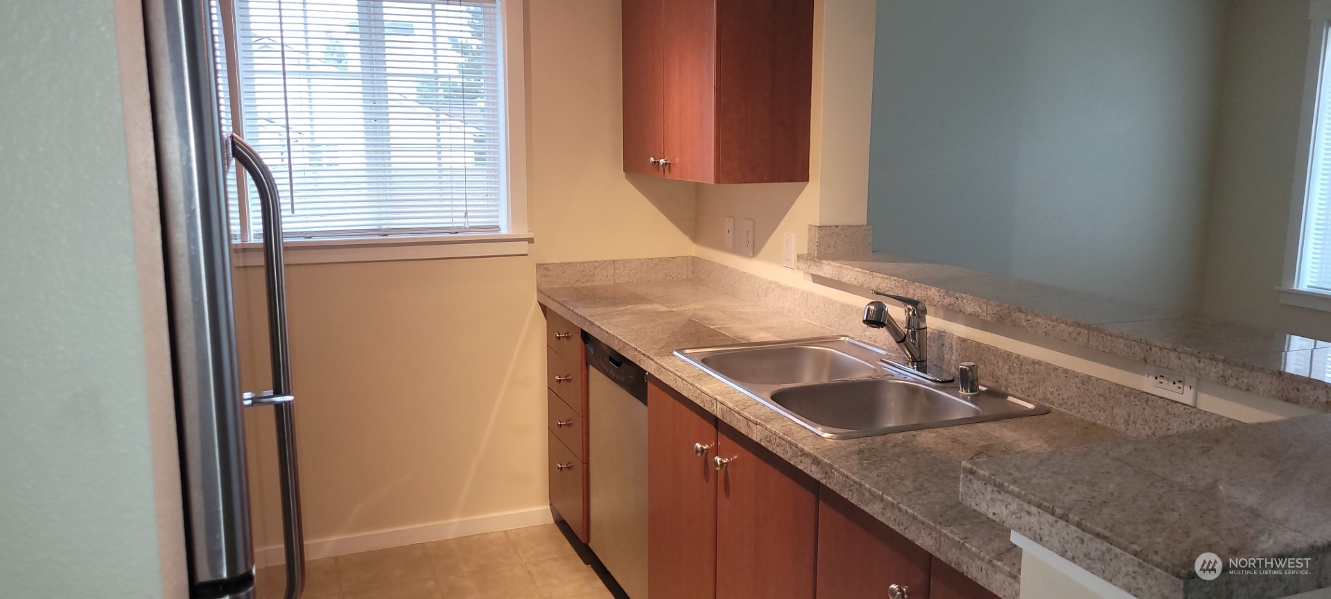 12404 East Gibson Road, Unit D201 Everett, WA 98204 - Photo 6 of 22 a bathroom with a granite countertop sink and a mirror