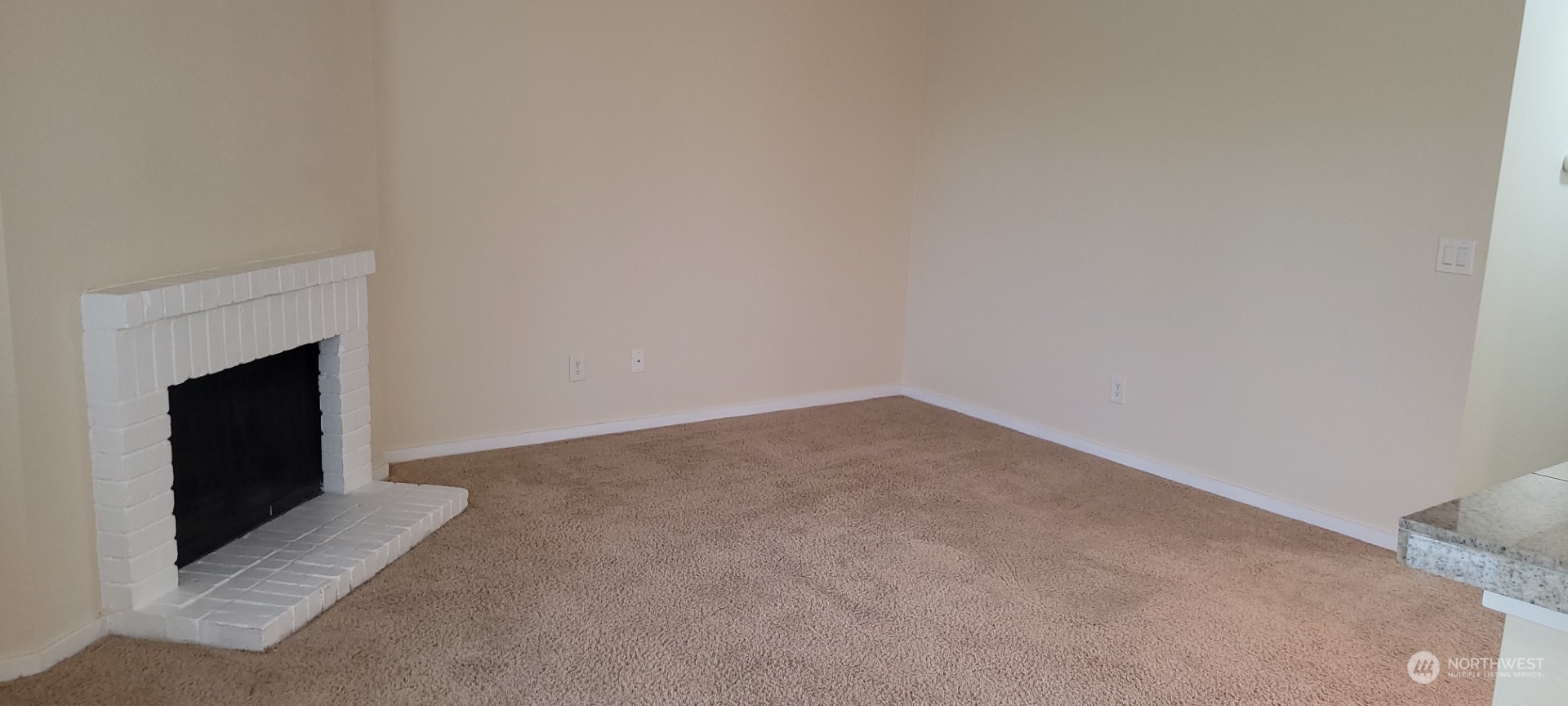 12404 East Gibson Road, Unit D201 Everett, WA 98204 - Photo 10 of 22 a view of an empty room with a fireplace