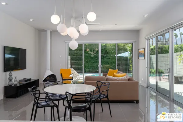 a outdoor dining space with furniture and garden view