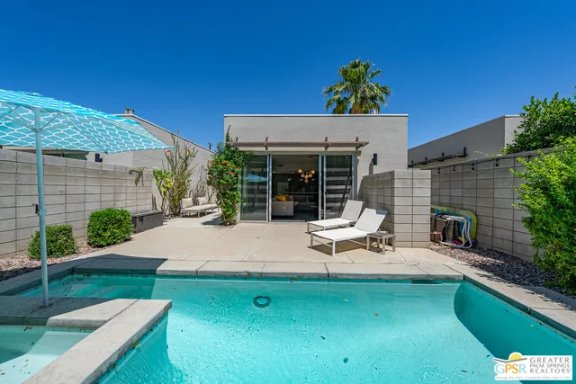 a view of a patio with a table and chairs