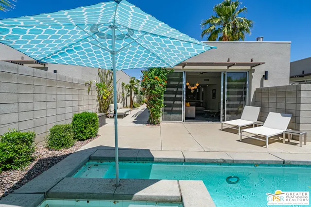 a backyard of a house with seating space