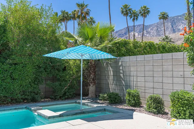 a garden view with a seating space