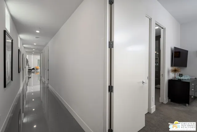 a view of a hallway with living room
