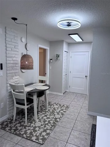 a room with a table and chairs