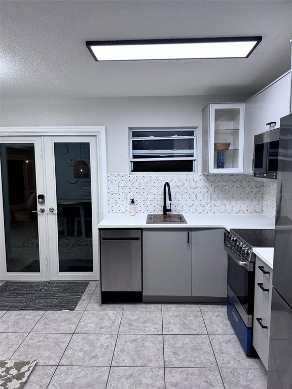 6304 Beechwood Avenue Sarasota, FL 34231 - Photo 15 of 41 a kitchen with stainless steel appliances granite countertop a sink and cabinets