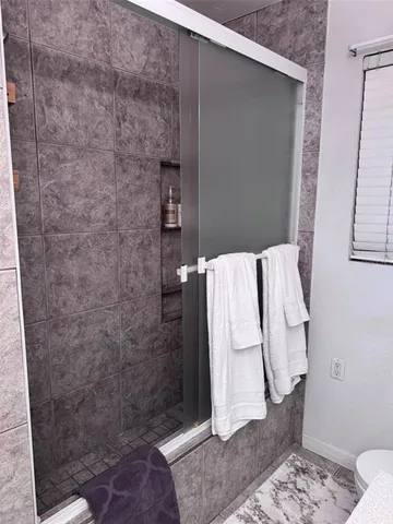 a bathroom with a sink and a shower