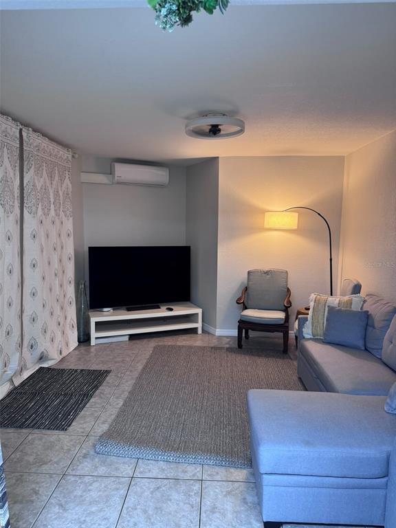 6304 Beechwood Avenue Sarasota, FL 34231 - Photo 18 of 41 a living room with furniture and a flat screen tv