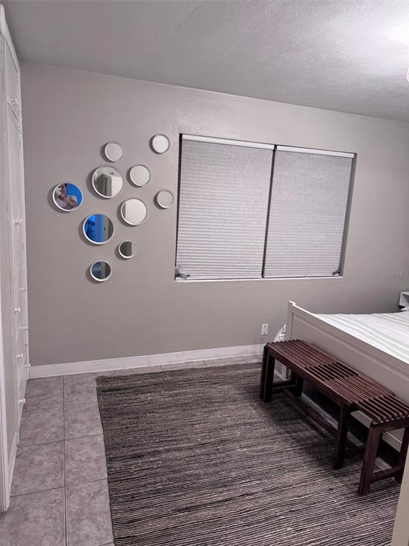 6304 Beechwood Avenue Sarasota, FL 34231 - Photo 25 of 41 a room with furniture and a wooden floor