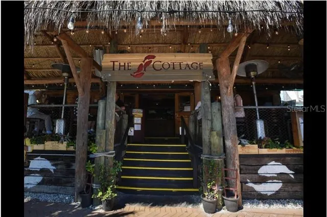 a view of a building with sitting area