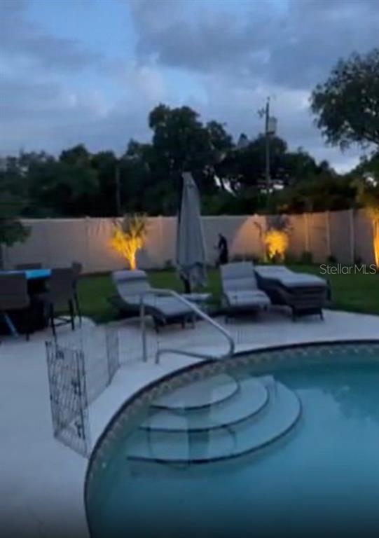 6304 Beechwood Avenue Sarasota, FL 34231 - Photo 6 of 41 a view of a lake with sitting area