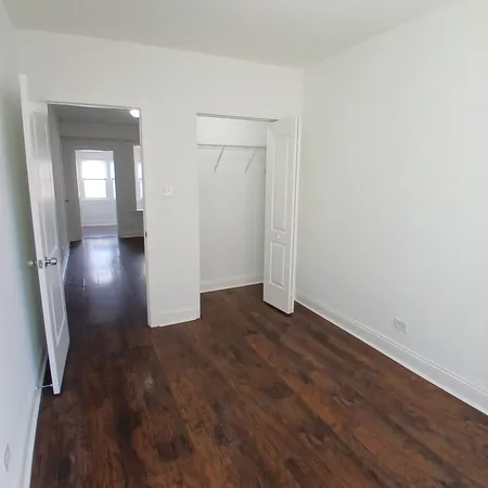 wooden floor in a hall with an entryway