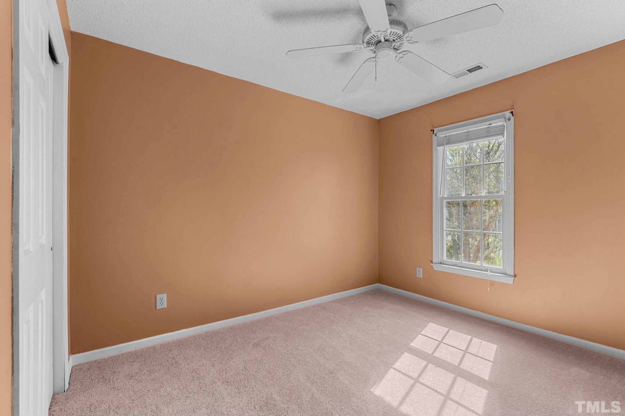 3408 Ribcowski Court Raleigh, NC 27616 - Photo 23 of 48 an empty room with windows and fan