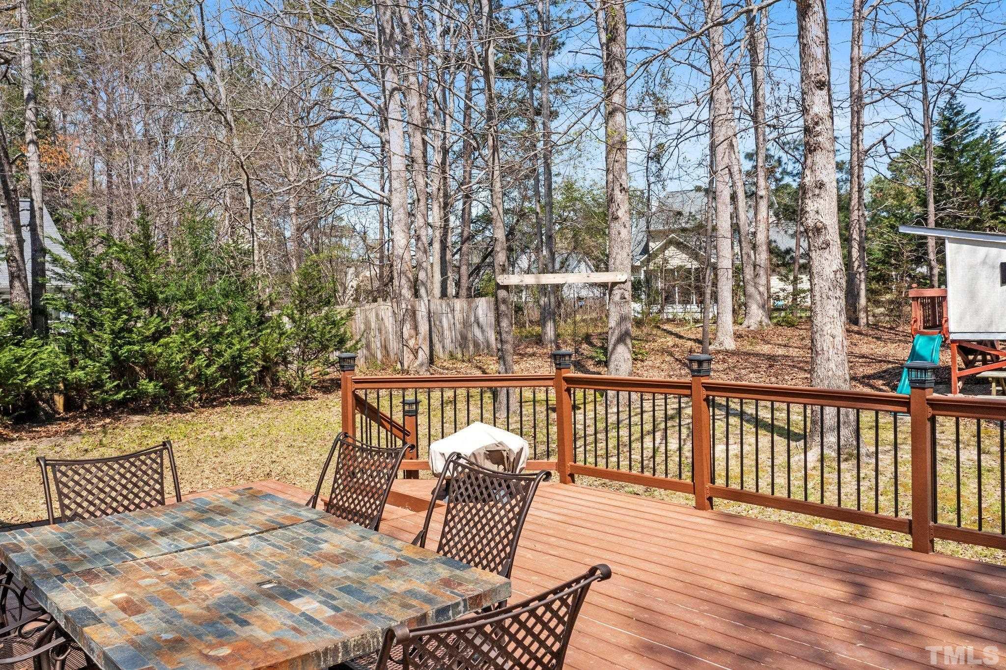 3408 Ribcowski Court Raleigh, NC 27616 - Photo 28 of 48 a view of balcony with wooden floor and outdoor seating