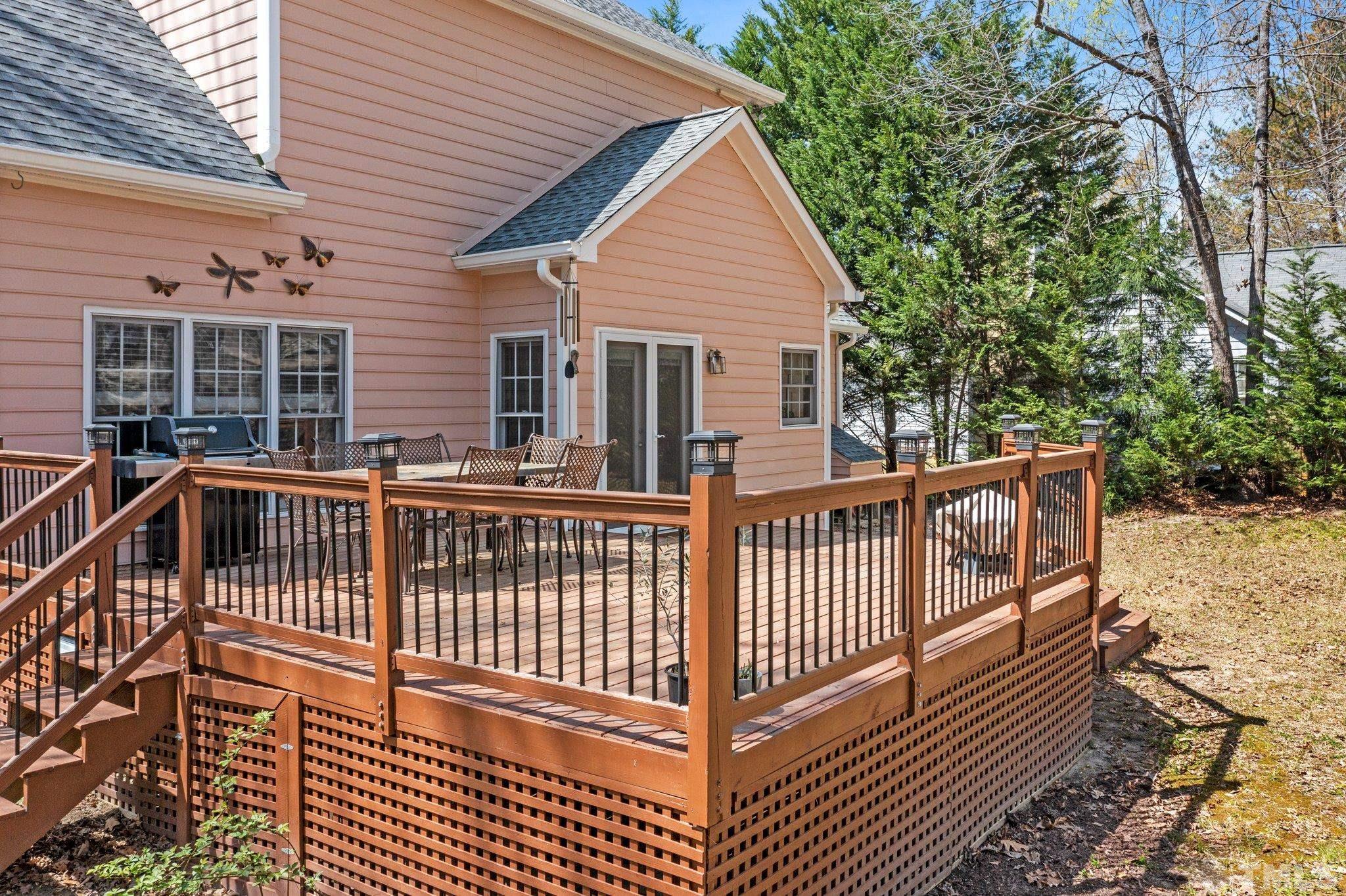 3408 Ribcowski Court Raleigh, NC 27616 - Photo 29 of 48 a view of a roof deck with wooden floor and fence