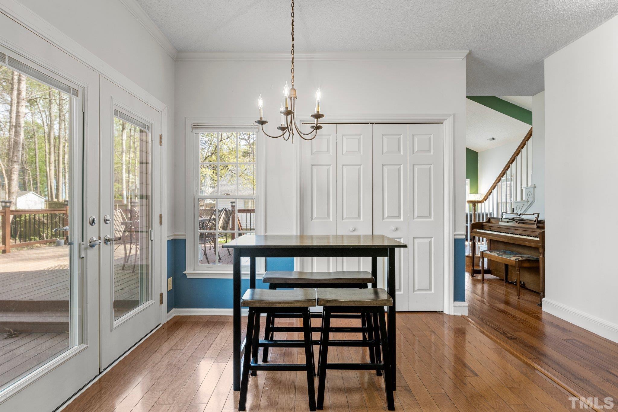 3408 Ribcowski Court Raleigh, NC 27616 - Photo 8 of 48 a view of a a dining room with furniture window and wooden floor