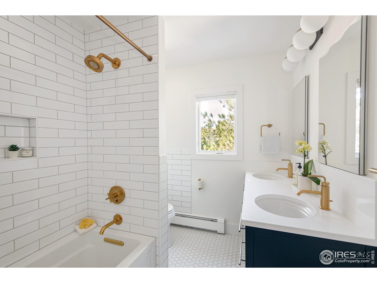 65 Bristlecone Way Boulder, CO 80304 - Photo 12 of 49 a bathroom with a sink mirror and vanity