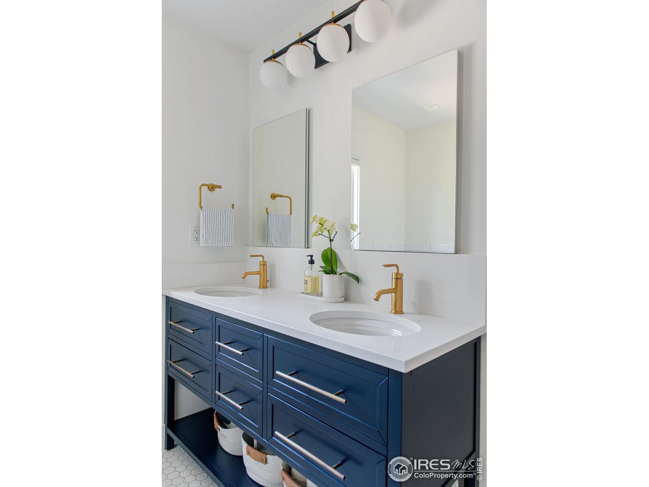 65 Bristlecone Way Boulder, CO 80304 - Photo 13 of 49 a bathroom with a sink and a mirror