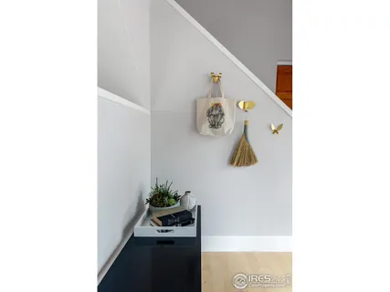 a workspace with furniture bookshelf and a window