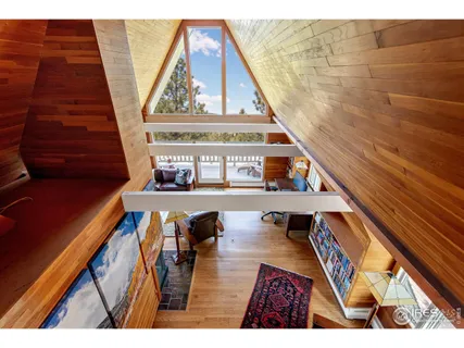 a view of kitchen with furniture and wooden floor