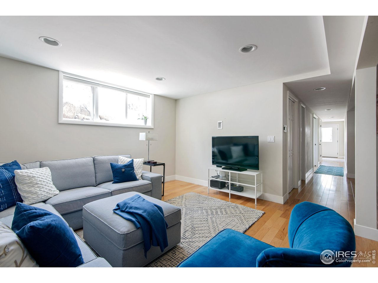 65 Bristlecone Way Boulder, CO 80304 - Photo 35 of 49 a living room with furniture and a flat screen tv