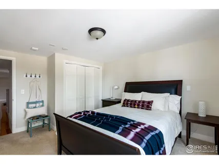 a bedroom with a bed and a table