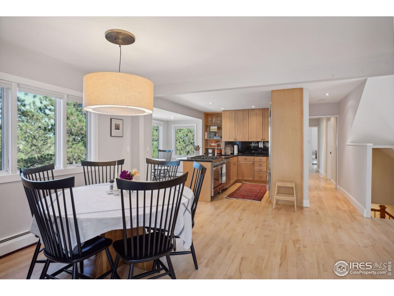 65 Bristlecone Way Boulder, CO 80304 - Photo 49 of 49 a view of a dining room with furniture window and wooden floor