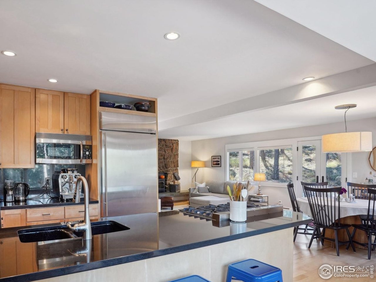 65 Bristlecone Way Boulder, CO 80304 - Photo 8 of 49 a view of a kitchen with dining table and chairs
