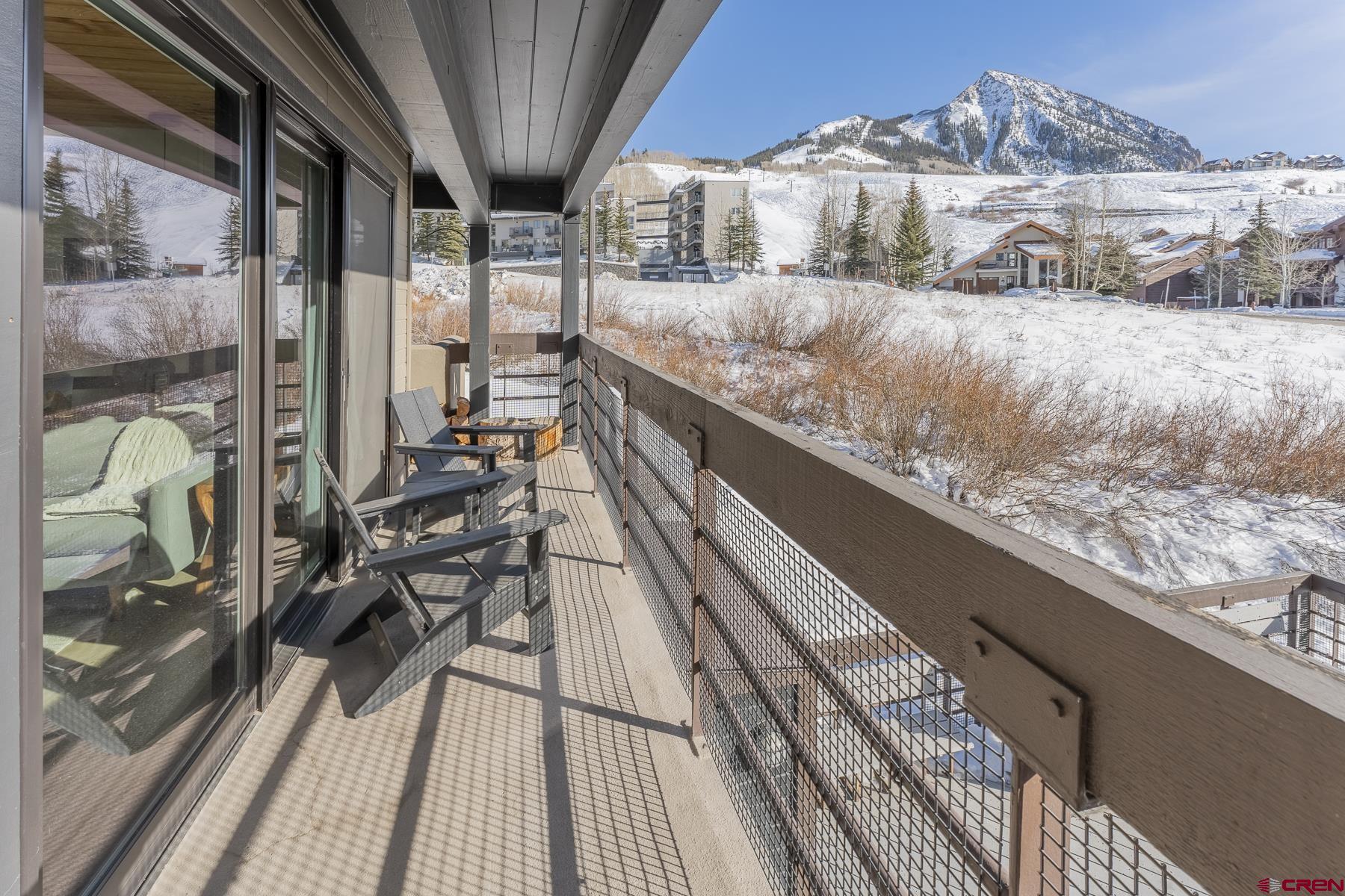 a view of balcony and wooden floor