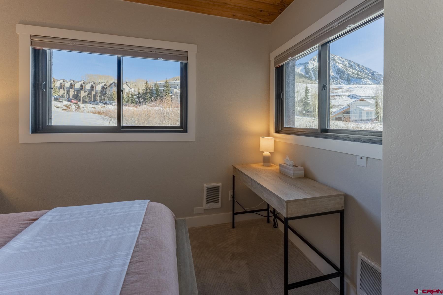 400 Gothic Road, Unit 207 Crested Butte, CO 81225 - Photo 16 of 35 a room that has a bed and a window