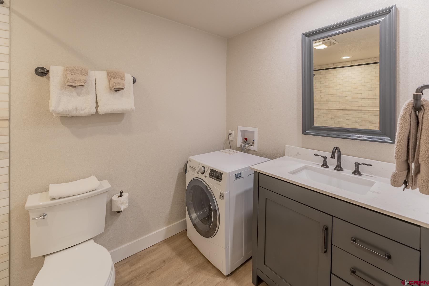 400 Gothic Road, Unit 207 Crested Butte, CO 81225 - Photo 18 of 35 a bathroom with a toilet sink and mirror