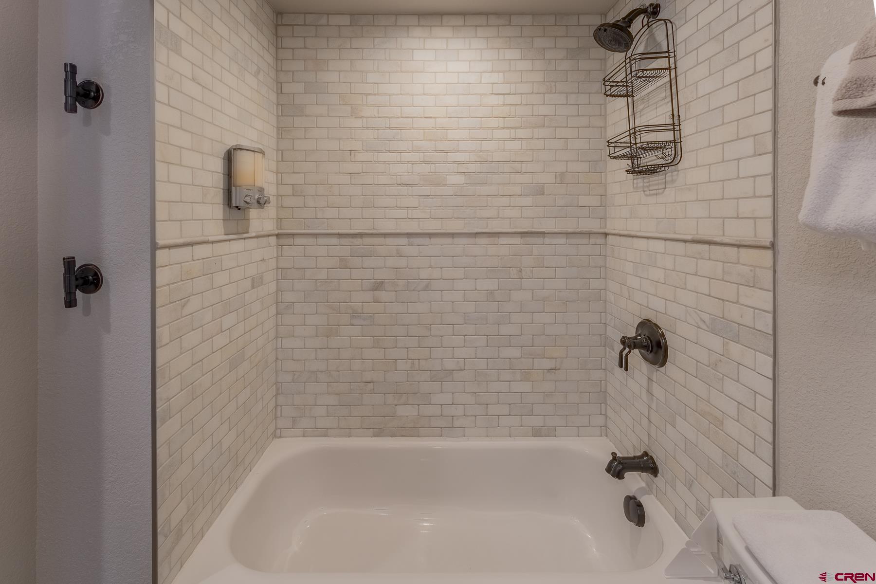 400 Gothic Road, Unit 207 Crested Butte, CO 81225 - Photo 19 of 35 a bathroom with a shower