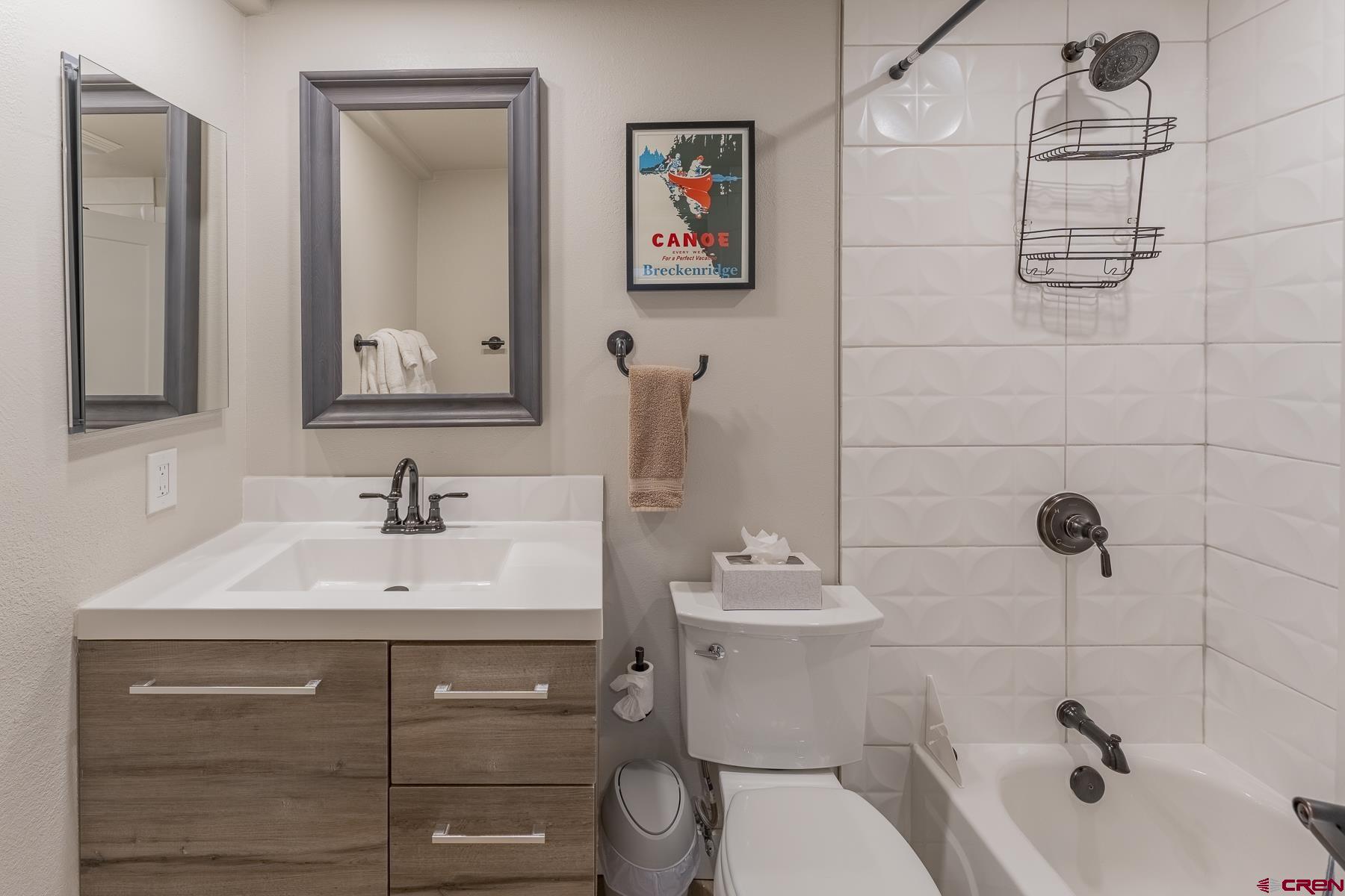 400 Gothic Road, Unit 207 Crested Butte, CO 81225 - Photo 22 of 35 a bathroom with a toilet sink and mirror