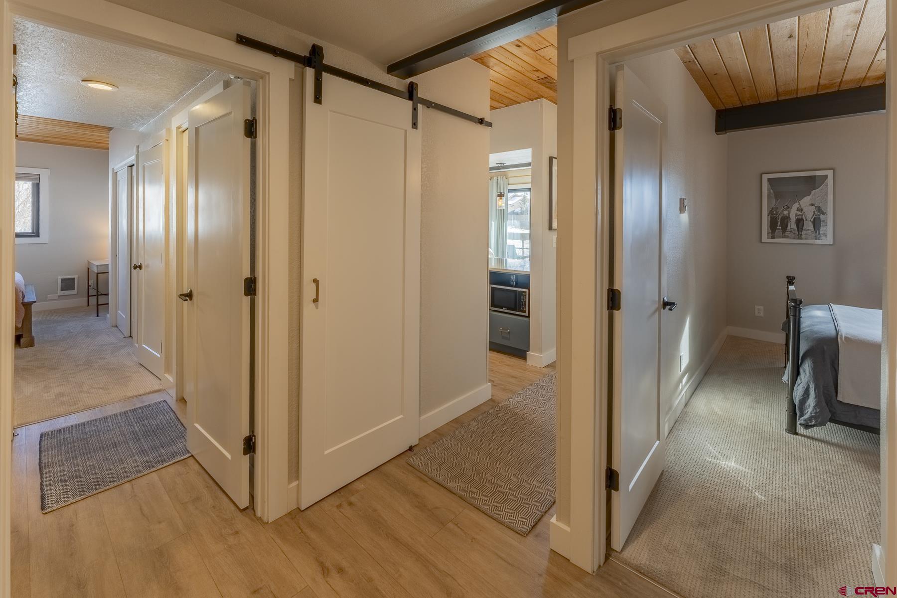 400 Gothic Road, Unit 207 Crested Butte, CO 81225 - Photo 23 of 35 a view of a hallway with wooden floor