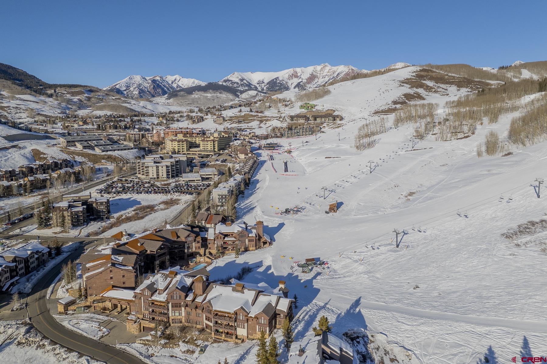 400 Gothic Road, Unit 207 Crested Butte, CO 81225 - Photo 32 of 35 a view of a big yard with mountains in the background